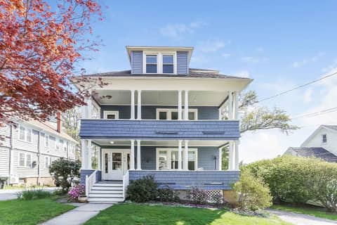 Multifamily house on Grennan Rd in West Hartford, with a deck.
