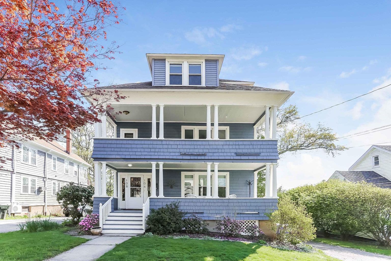 Multifamily house on Grennan Rd in West Hartford, with a deck.