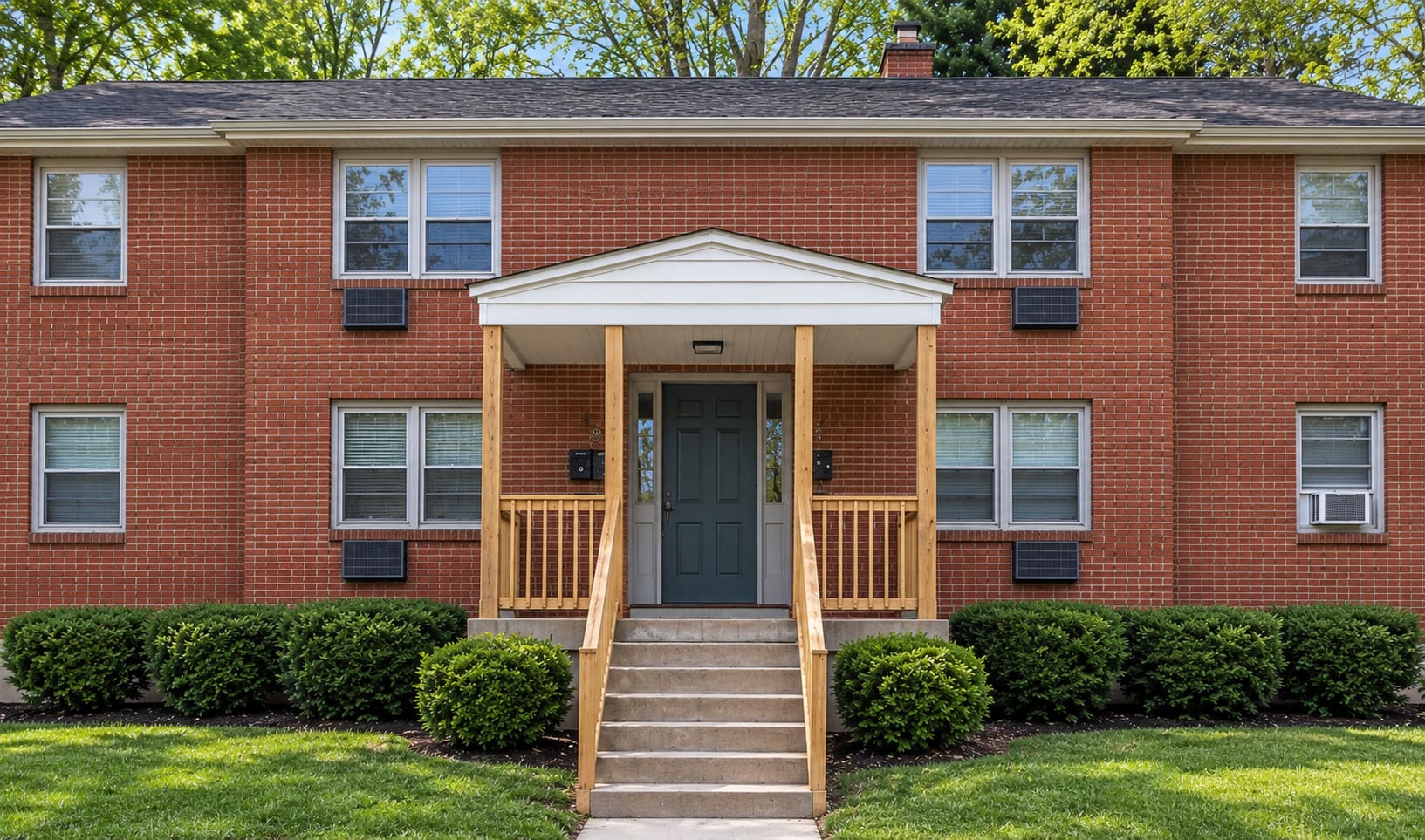 Front of 8 Manchester Circle, a two-story brick building.