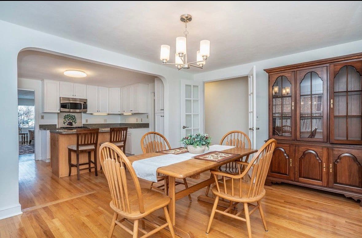 Living room with hardwood floors in the first-floor home on Milton St.