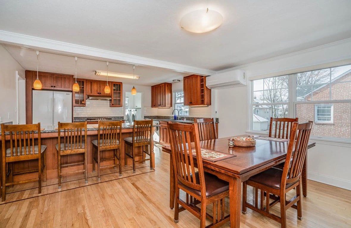 Living room with hardwood floors in the upper home on Milton St.