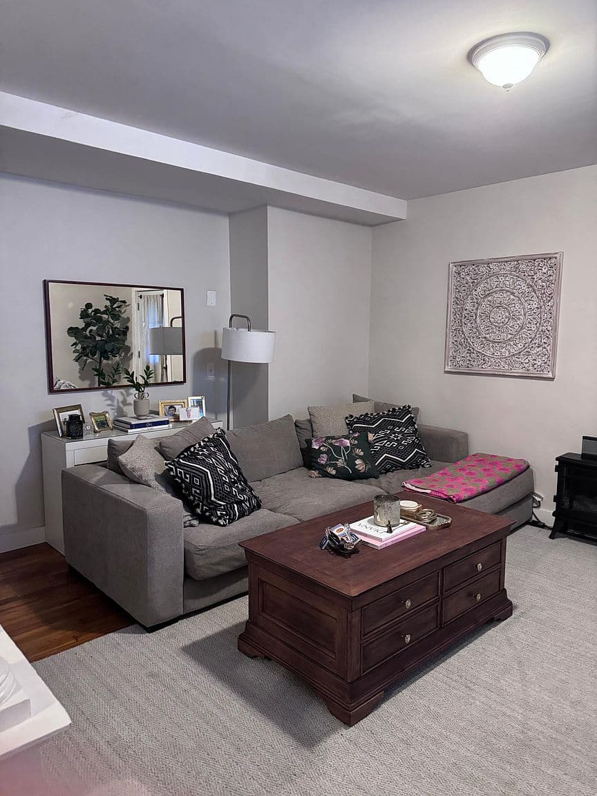 Living room with hardwood floors in the first-floor apartment on Sedgwick Rd.